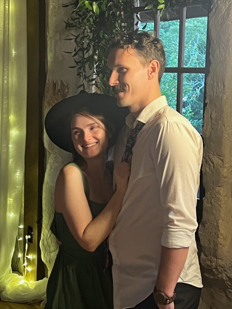 Samuel and Micah from Awaiting Acreage smiling and slow-dancing.