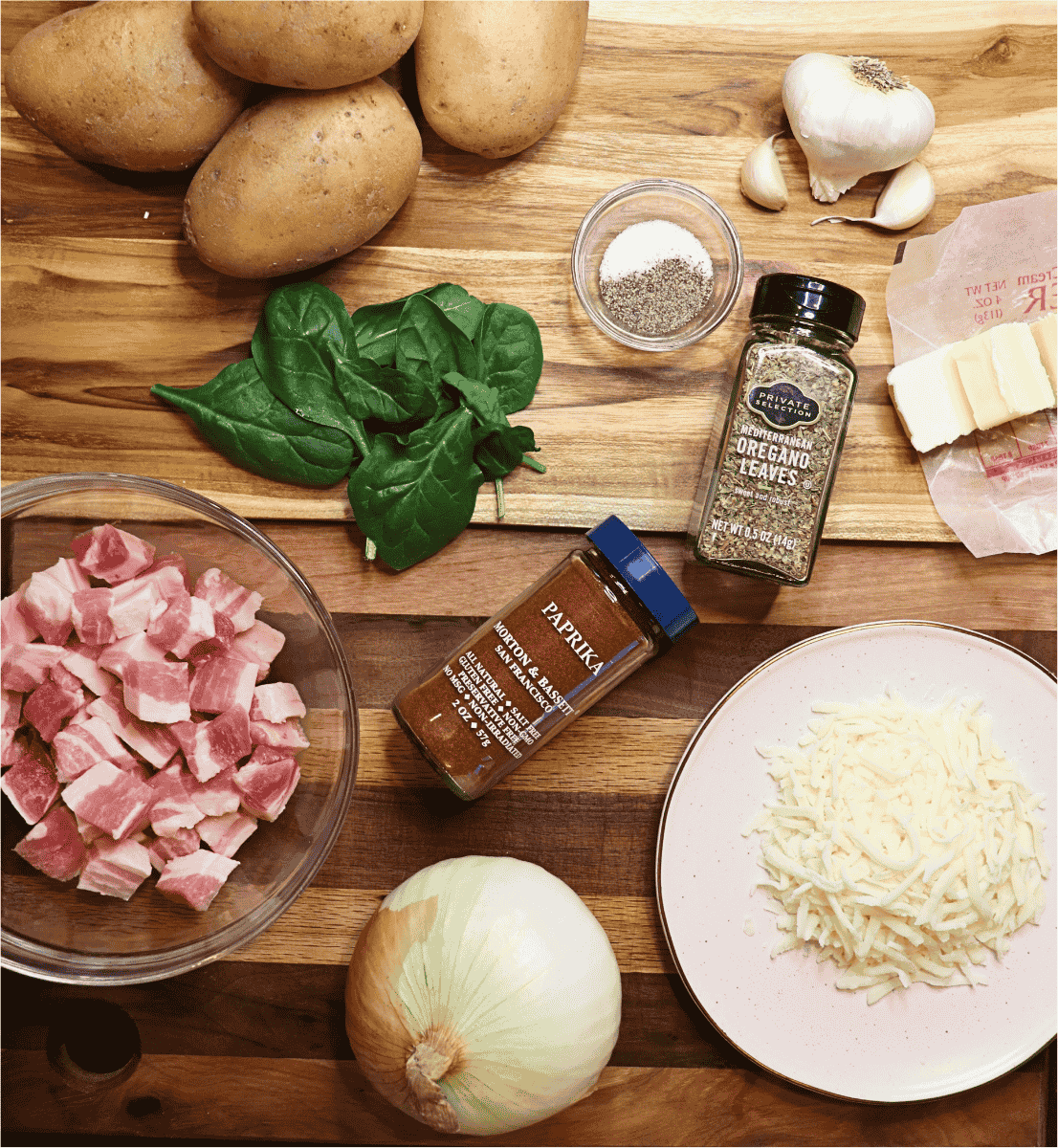 Ingredients for the German potato skillet recipe laid out on a wooden background