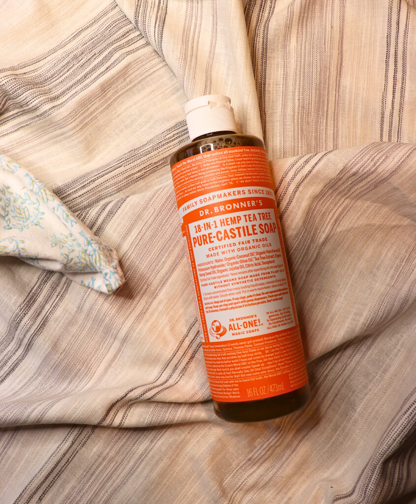 Bottle of castile soap on a linen cloth