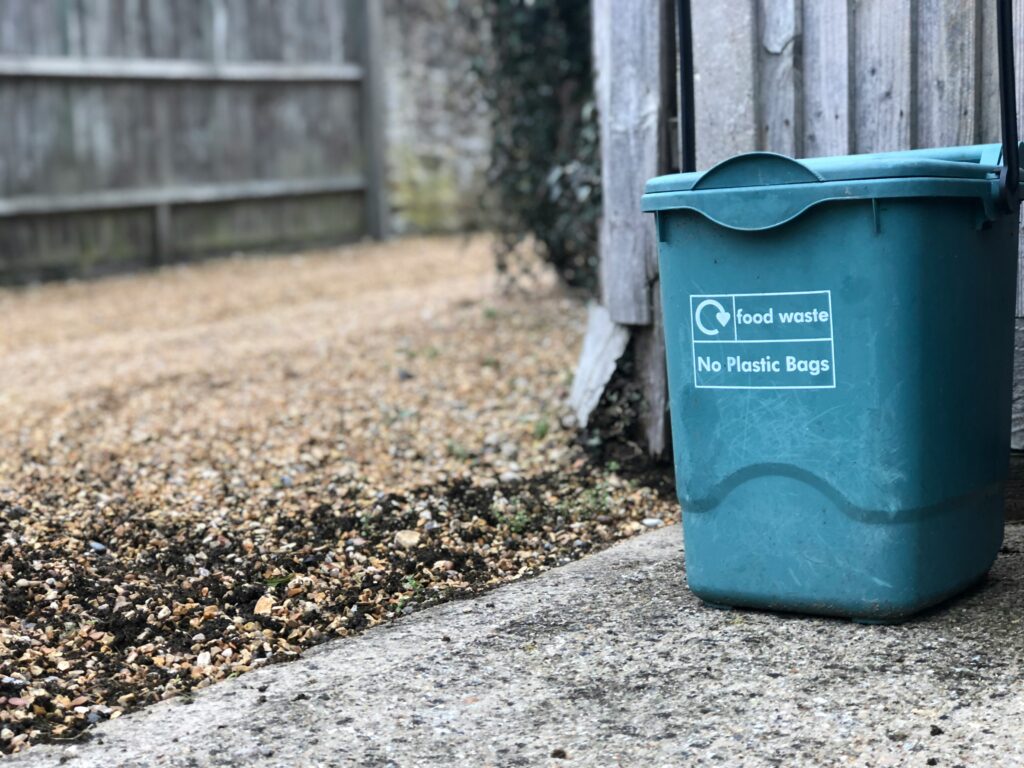 Small compost bin in a backyard at home