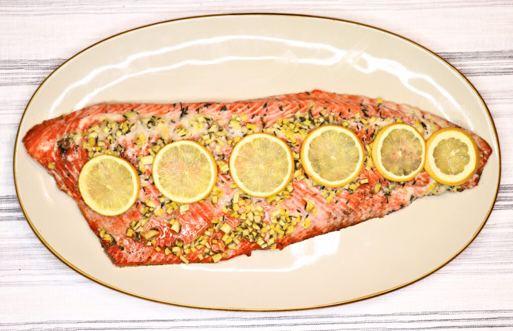 full shot of honey roasted salmon on a cream colored plate