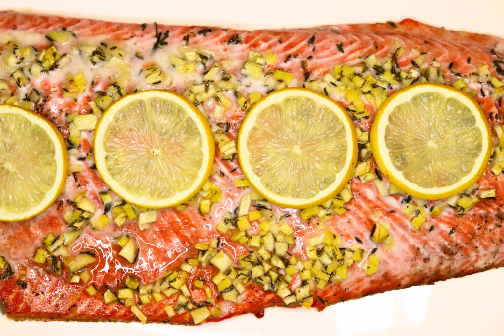 Honey roasted salmon with sliced lemons on top