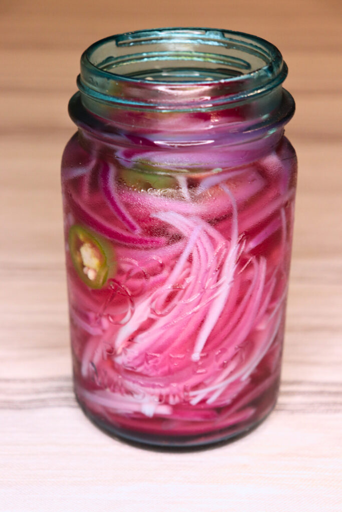 spicy pickled onions about to pickle in the fridge