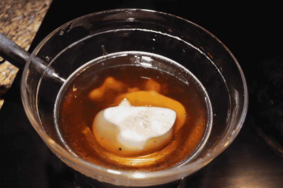 Melted wax in a glass bowl being double broiled
