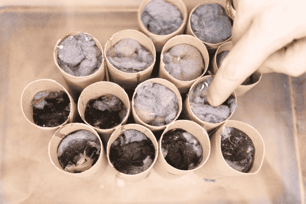 Stuffing lint into partially filled toilet paper rolls