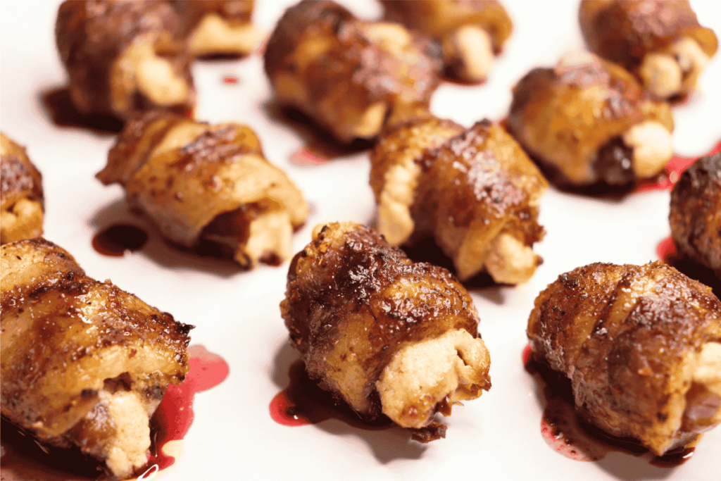 stuffed bacon-wrapped dates on a plate