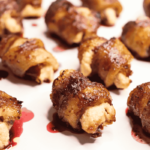 stuffed bacon-wrapped dates on a plate