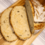 Sliced Jalapeño Cheddar Sourdough on a wooden board