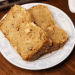 Apple bread sliced on a white saucer