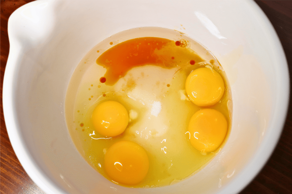 Large white bowl with unmixed ingredients in it.