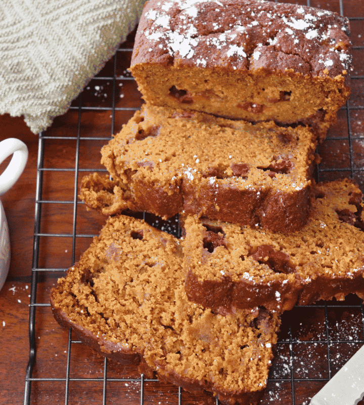 Pumpkin Cranberry Bread by a cup of coffee