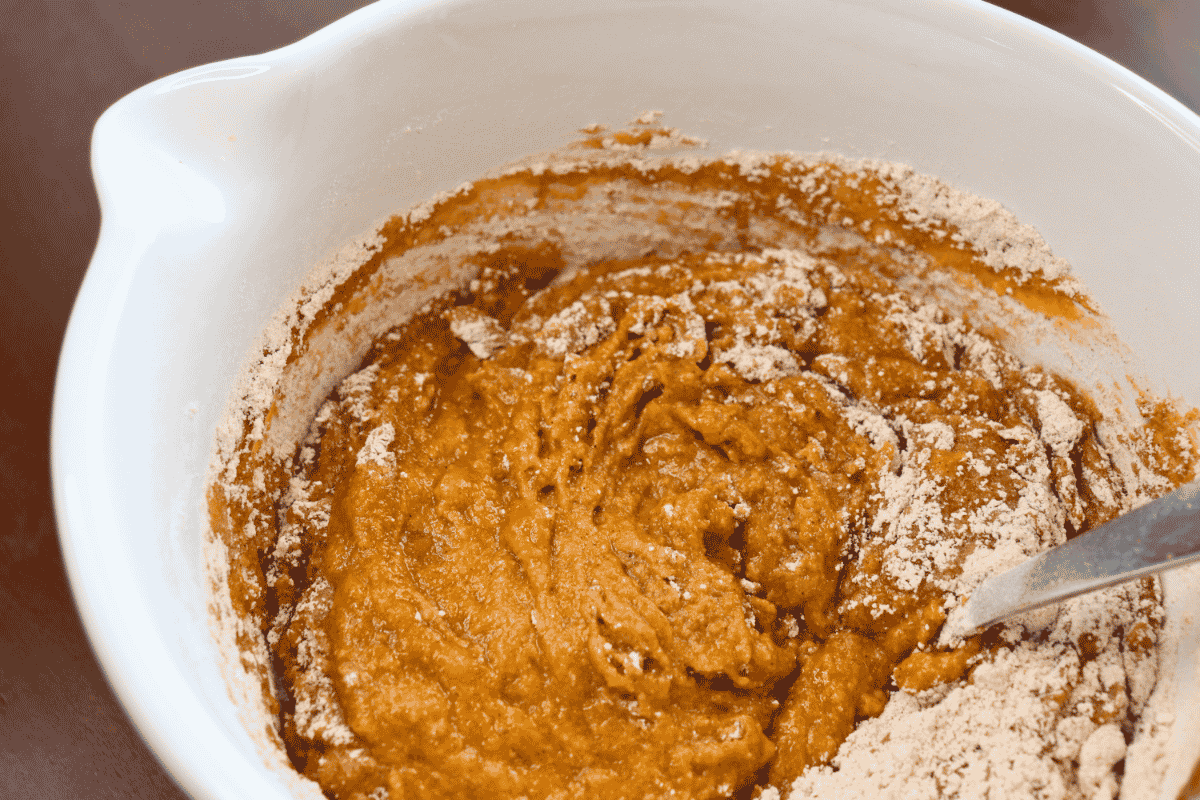 Mixing dry and wet ingredients in a bowl